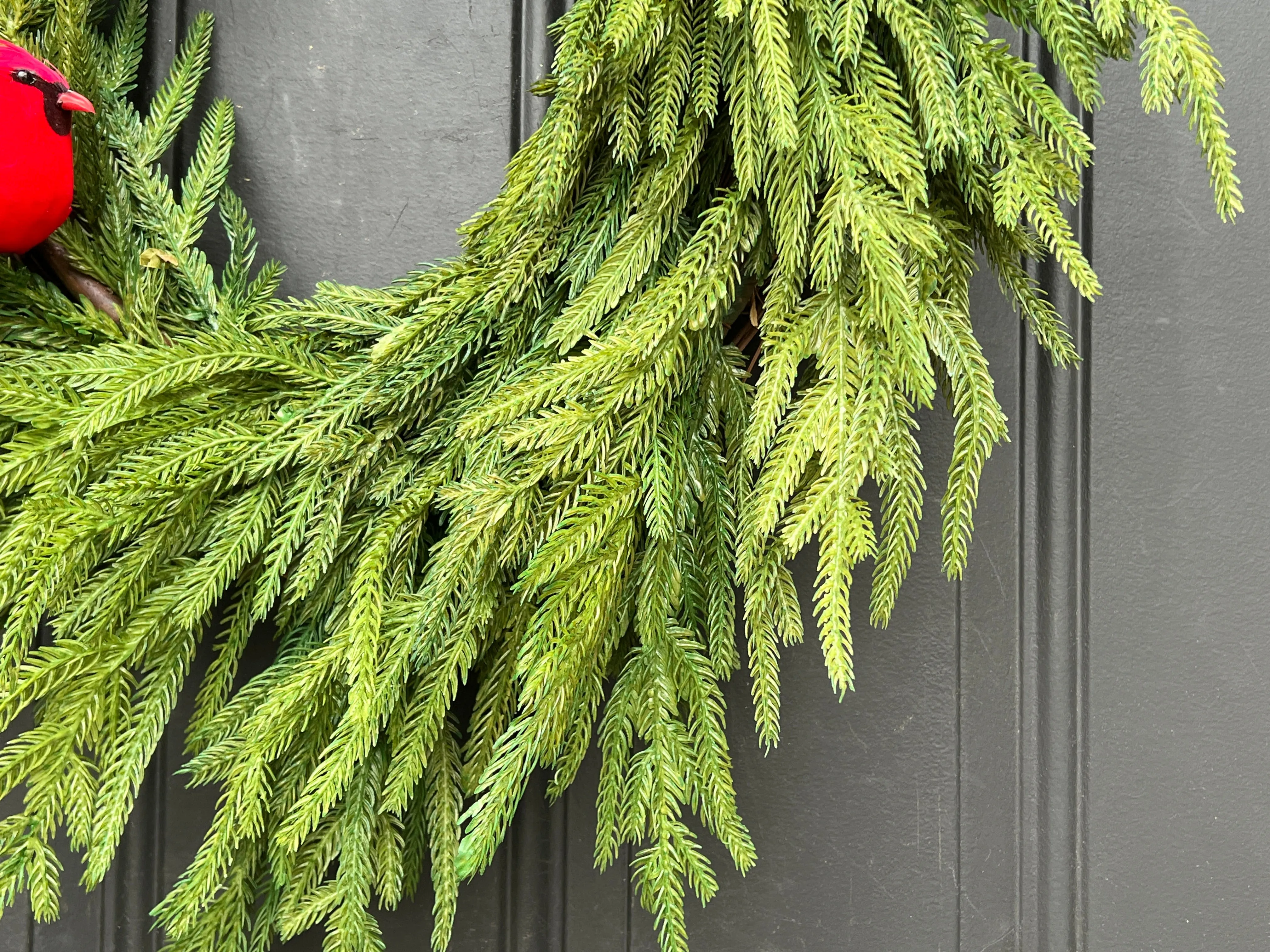 Natural Touch Norfolk Pine Wreath with Red Cardinals